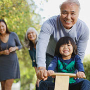 link to 'Beyond Monetary Policy' story photo of an adult pushing a child on a bicycle