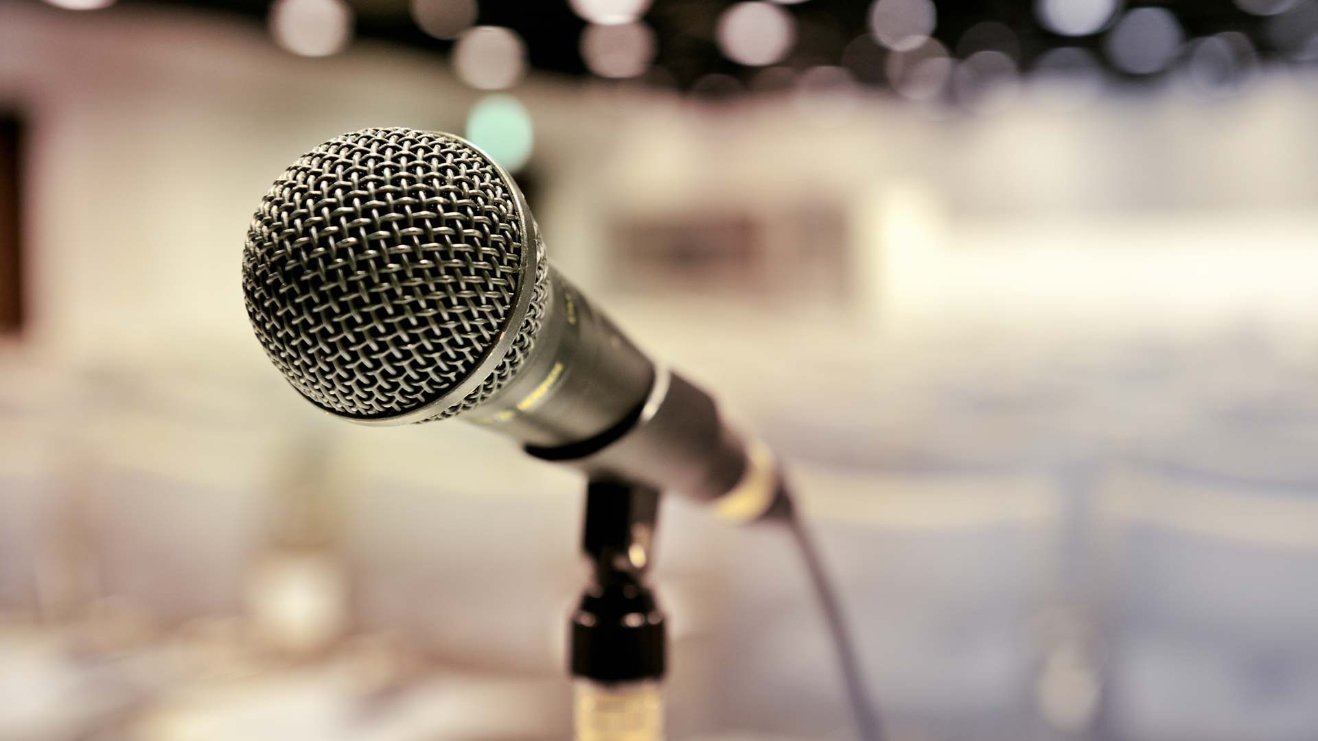 Microphone on a blurry background.