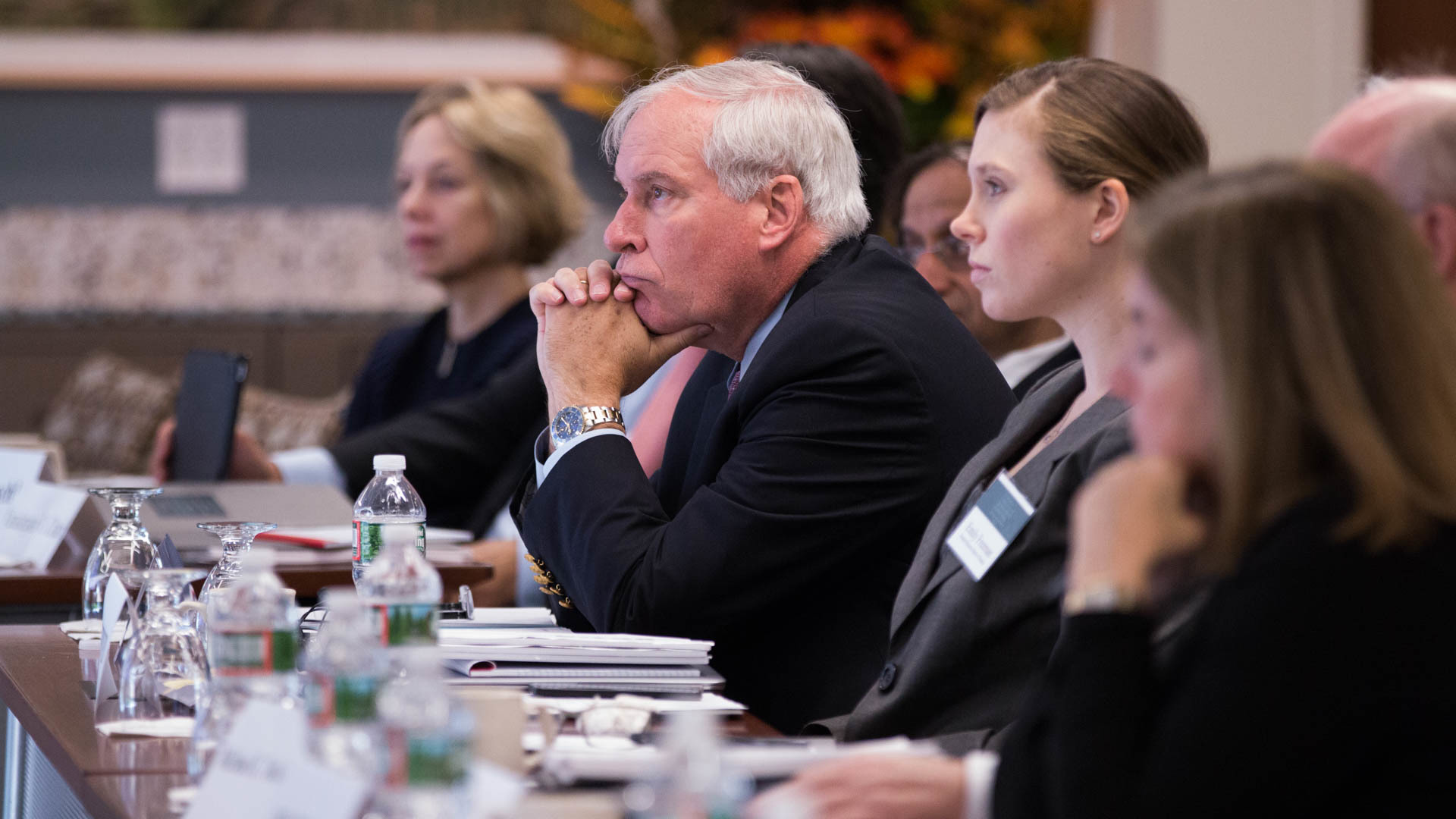 Photo of Eric S. Rosengren listening to panelists during the 61st Economic Conference.
