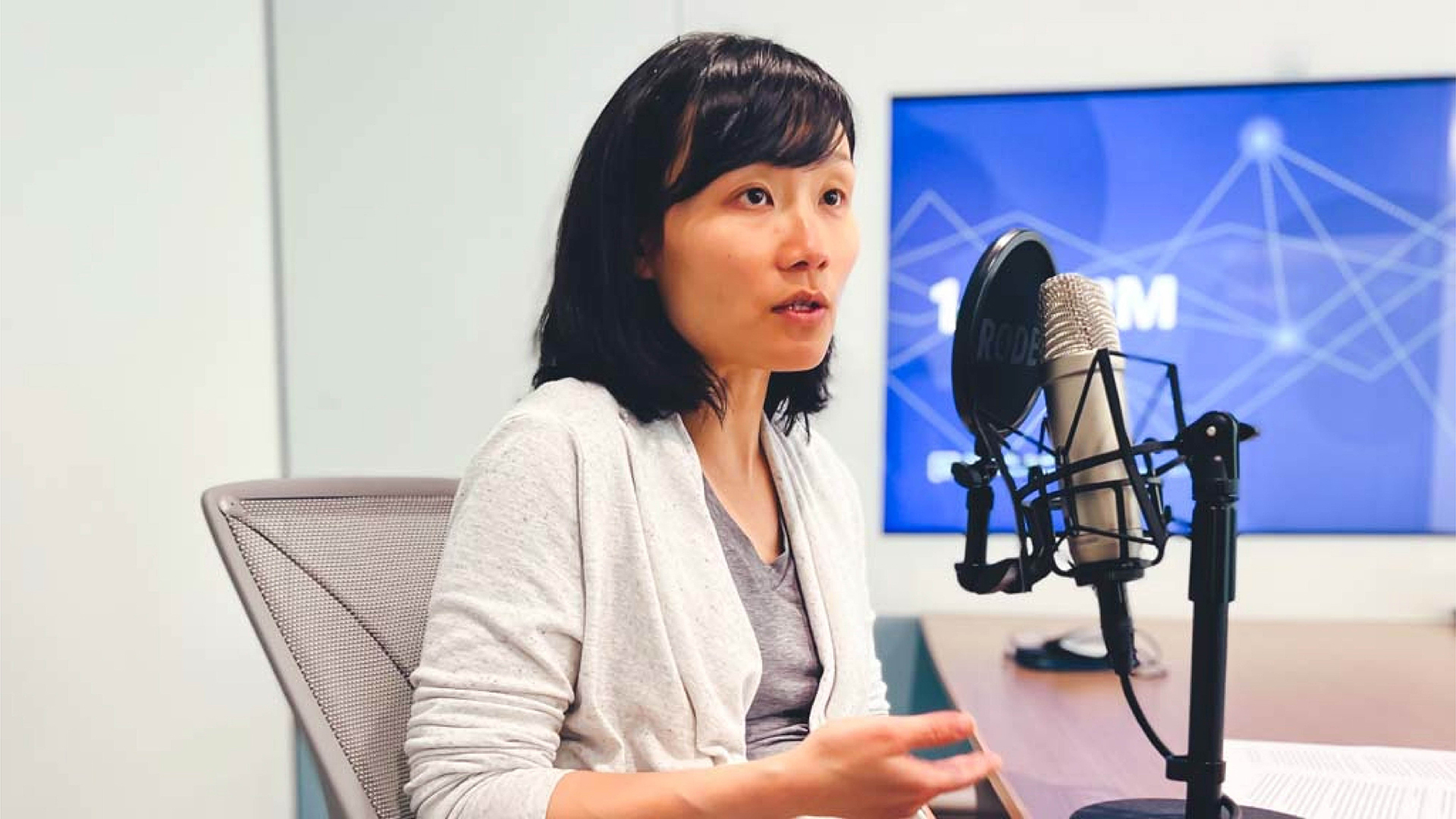 A photograph of Jenny Tang speaking on the Six Hundred Atlantic podcast.