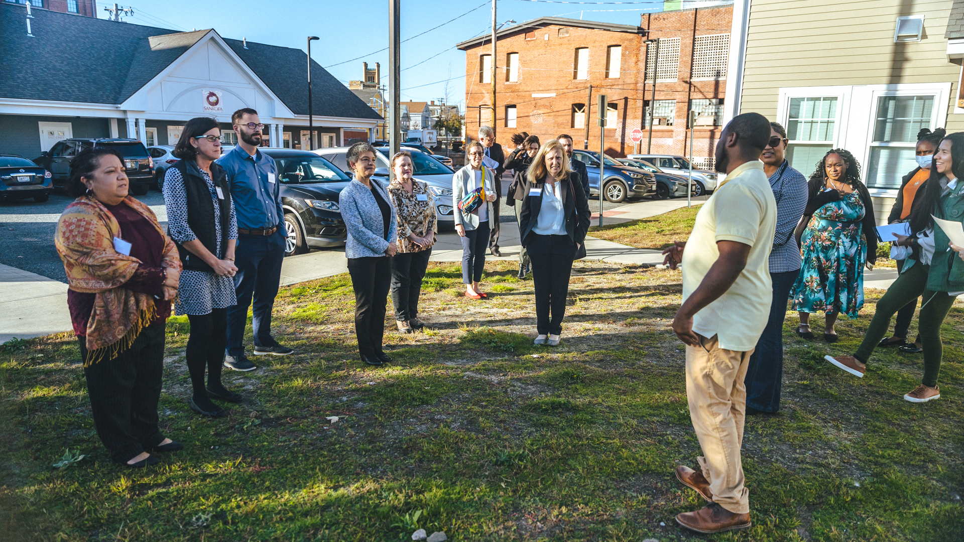 Photo of Susan and community leaders touring the West Elmwood Area.