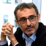 A photograph of Tommaso Monacelli for the Boston Fed's 69th Economic Conference.