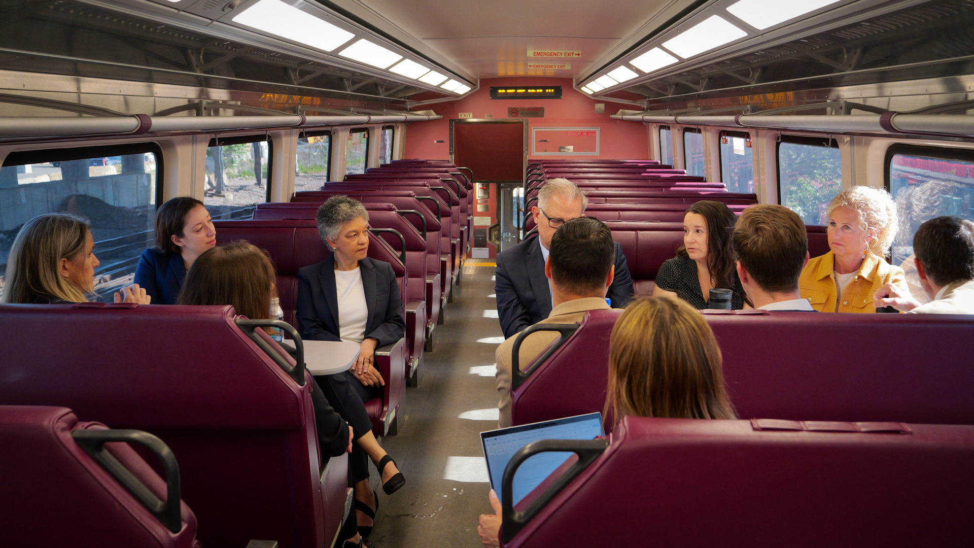 Susan M. Collins and Karen Pennell meet with MBTA Leadership (Lynsey Hefferman, Mike Muller, and Scott Bosworth) on the commuter rail to discuss the intersections between transit and economic growth