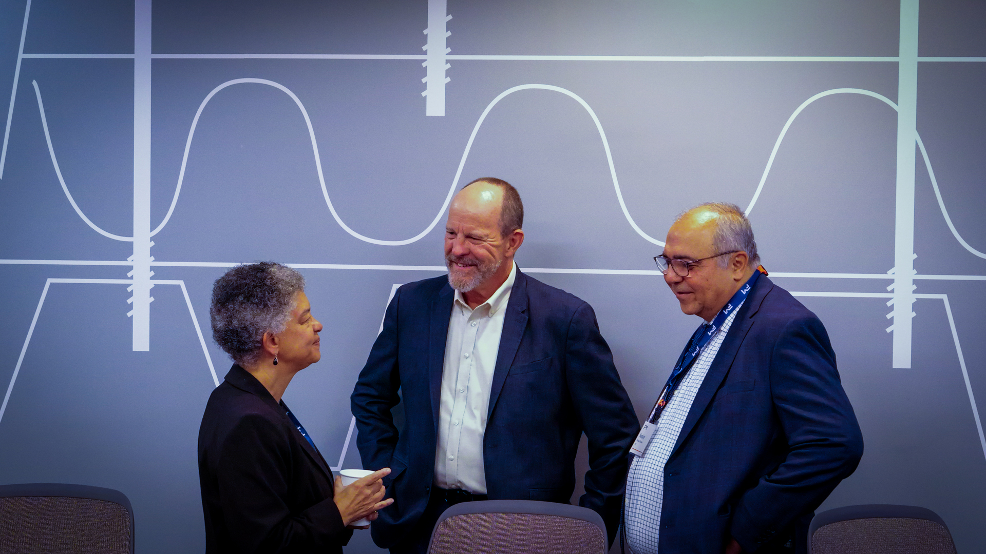 A photograph of Susan greeting FM Research Campus members prior to the round table discussion in Rhode Island.