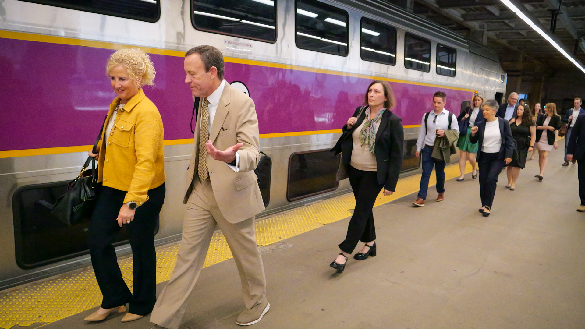 Karen Pennell and Susan M. Collins walking with MBTA Officials to catch the Southcoast Commuter Rail to Fall River, MA.