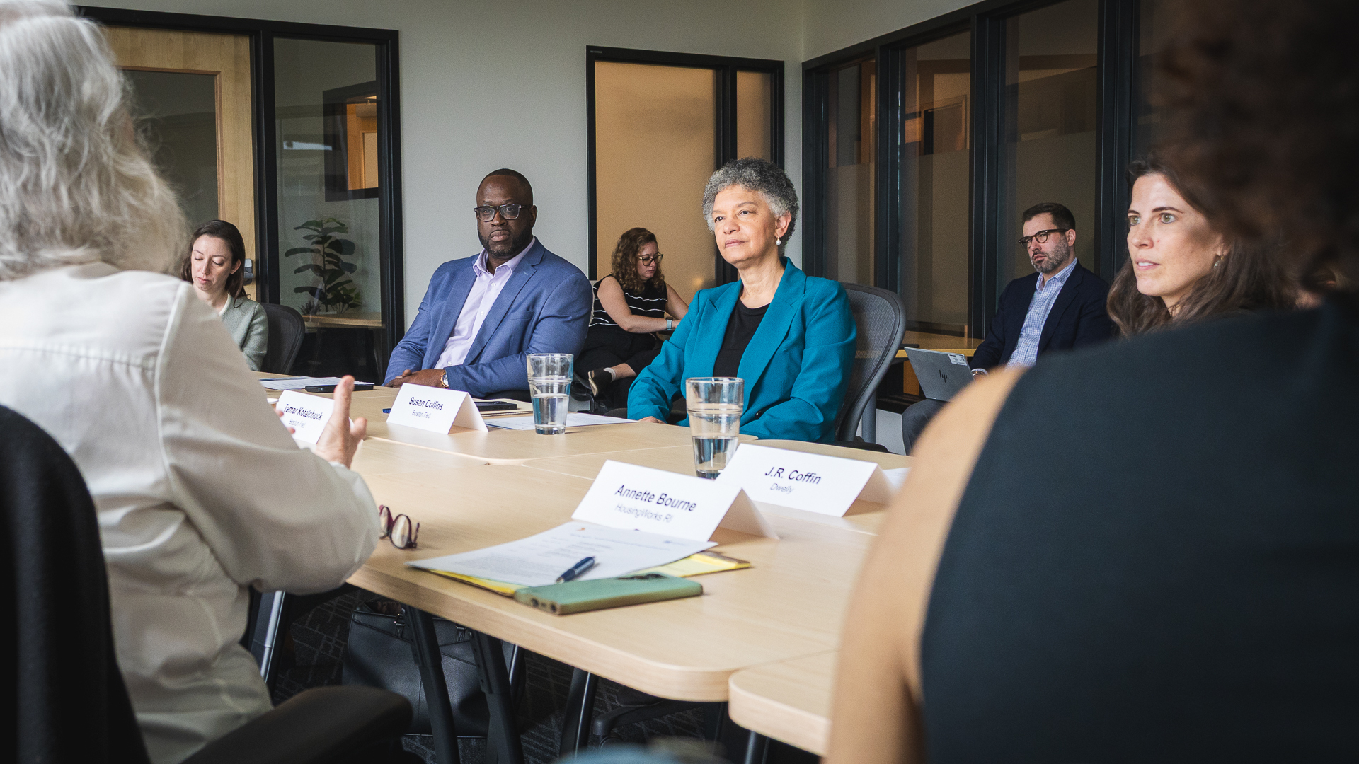The Boston Fed's Susan M. Collins and participants listen to HousingWorks RI's Annette Bourne give her perspective on local challenges during a housing and development roundtable at CIC Providence in Rhode Island. May 6, 2026.
