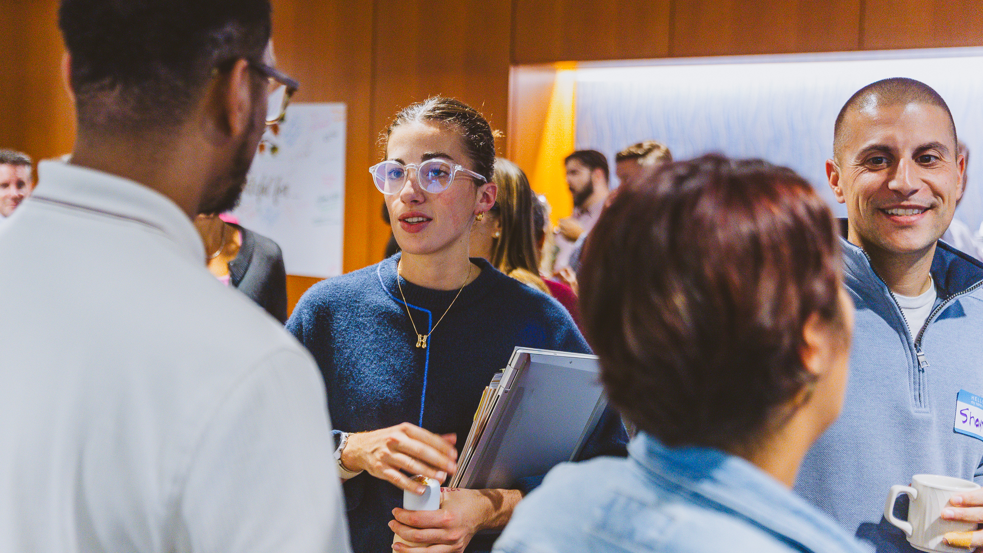 Photo of Hannah speaking with Dajon during the celebration.
