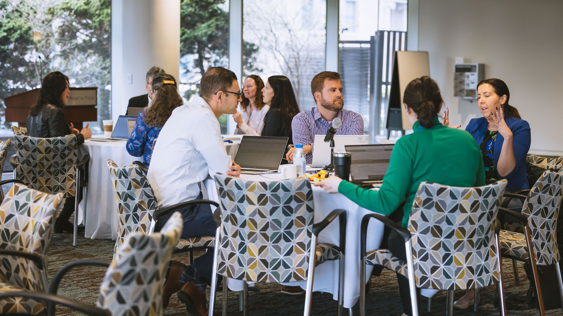 Boston Fed employees collaborating in a modern office environment